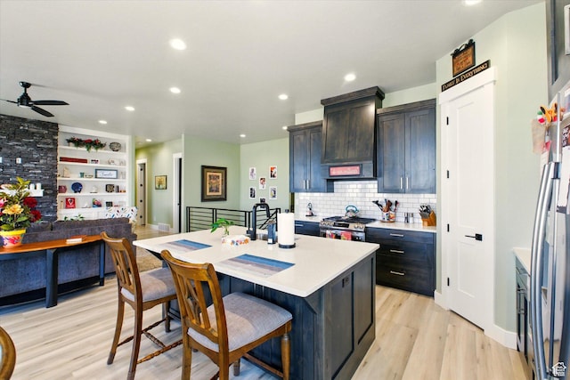 653 S 1140 E, Smithfield, UT 84335 - kitchen featuring appliances with stainless steel finishes, light countertops, ceiling fan, recessed lighting, and backsplash