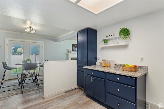 719 N 400 W, Orem, UT 84057 - kitchen featuring blue cabinetry, light wood finished floors, ornamental molding, light stone counters, and open shelves