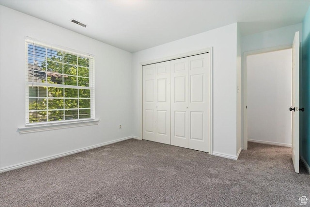 719 N 400 W, Orem, UT 84057 - unfurnished bedroom featuring carpet, baseboards, and a closet