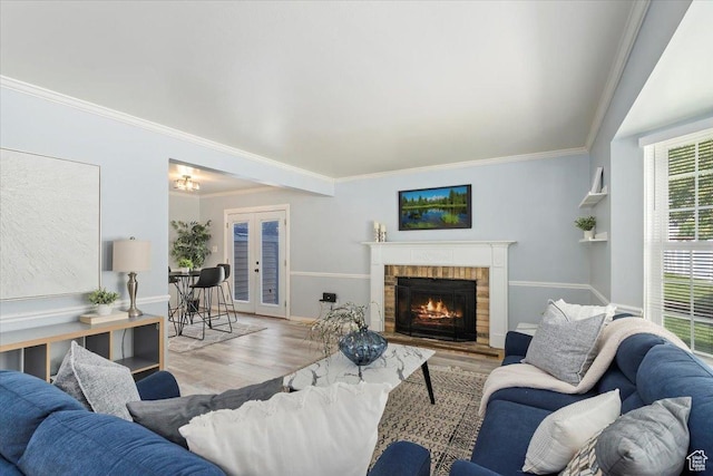 719 N 400 W, Orem, UT 84057 - living area with crown molding, wood finished floors, a brick fireplace, and baseboards