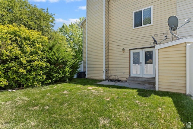 719 N 400 W, Orem, UT 84057 - back of property with a lawn and french doors