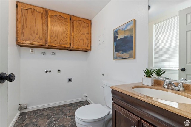719 N 400 W, Orem, UT 84057 - bathroom with toilet, vanity, baseboards, and stone finish floors