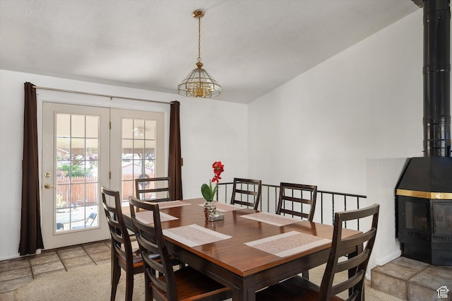 2263 W 4400 S, Roy, UT 84067 - dining space with a wood stove, light stone finish floors, and french doors