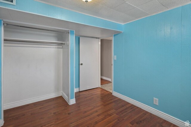 2263 W 4400 S, Roy, UT 84067 - unfurnished bedroom with a closet, wood finished floors, baseboards, and crown molding