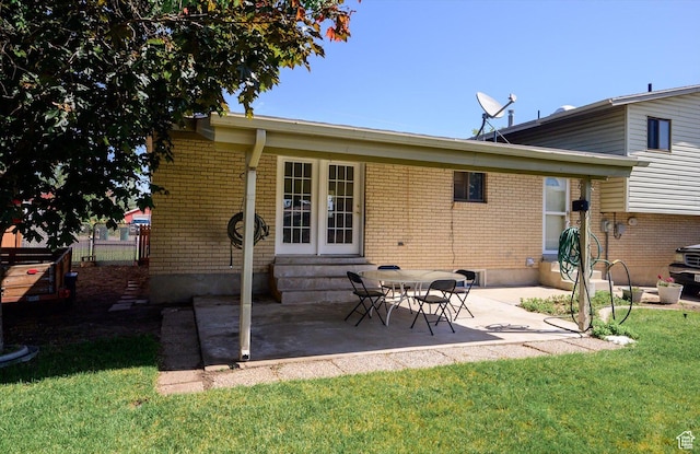 2263 W 4400 S, Roy, UT 84067 - rear view of house with brick siding, entry steps, and a patio