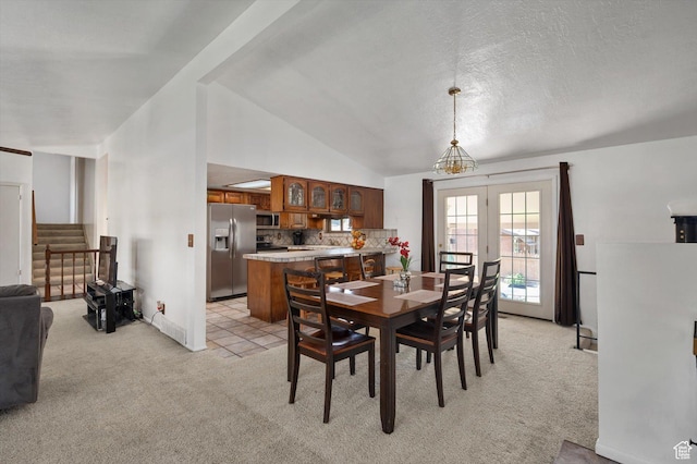 2263 W 4400 S, Roy, UT 84067 - dining area featuring light carpet, stairway, vaulted ceiling, and baseboards