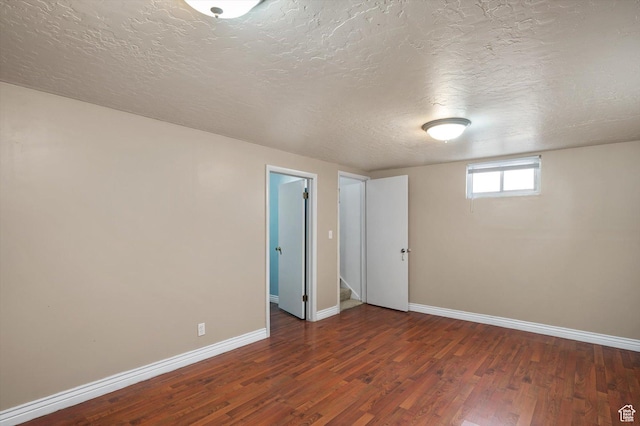 2263 W 4400 S, Roy, UT 84067 - unfurnished room featuring baseboards, wood finished floors, and a textured ceiling