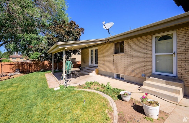 2263 W 4400 S, Roy, UT 84067 - back of house featuring entry steps, a patio area, and brick siding