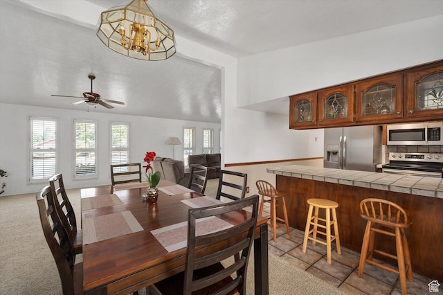 2263 W 4400 S, Roy, UT 84067 - dining space with a chandelier, a ceiling fan, lofted ceiling, and light colored carpet
