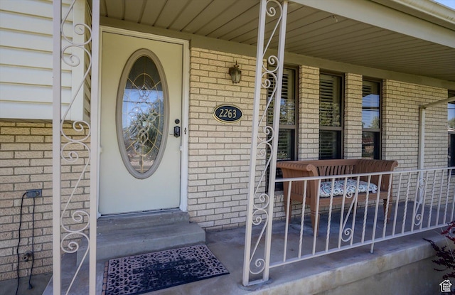 2263 W 4400 S, Roy, UT 84067 - view of exterior entry featuring brick siding and covered porch