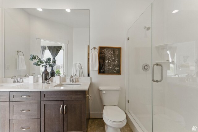 11398 Lake Run Rd, South Jordan, UT 84095 - full bath with double vanity, a stall shower, toilet, tile patterned floors, and baseboards