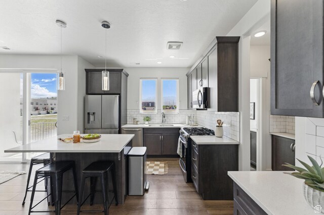 11398 Lake Run Rd, South Jordan, UT 84095 - kitchen featuring stainless steel appliances, plenty of natural light, backsplash, and recessed lighting