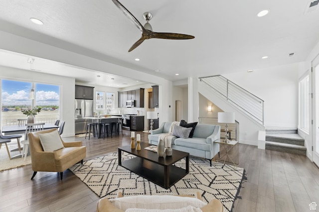 11398 Lake Run Rd, South Jordan, UT 84095 - living area with stairs, a ceiling fan, wood finished floors, recessed lighting, and baseboards