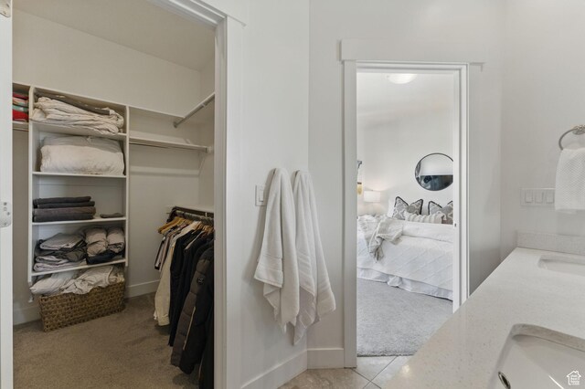 11398 Lake Run Rd, South Jordan, UT 84095 - spacious closet with light colored carpet and a sink