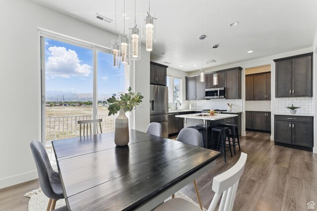 11398 Lake Run Rd, South Jordan, UT 84095 - dining room featuring wood finished floors, recessed lighting, a chandelier, and baseboards
