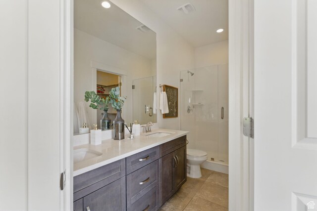 11398 Lake Run Rd, South Jordan, UT 84095 - bathroom with a shower stall, toilet, double vanity, tile patterned flooring, and a spacious closet