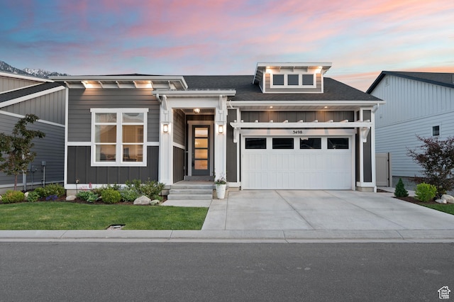 3498 E Bougival Ln S, Cottonwood Heights, UT 84093 - view of front of property featuring board and batten siding, driveway, a garage, a front yard, and a shingled roof