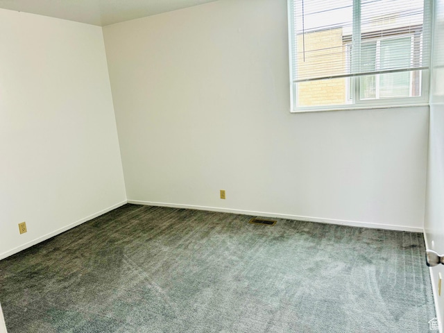 4419 S Rosehaven Ct Unit A, West Valley City, UT 84120 - empty room with dark carpet and baseboards