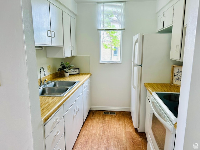 4419 S Rosehaven Ct Unit A, West Valley City, UT 84120 - kitchen with electric stove, a sink, light wood finished floors, baseboards, and light countertops