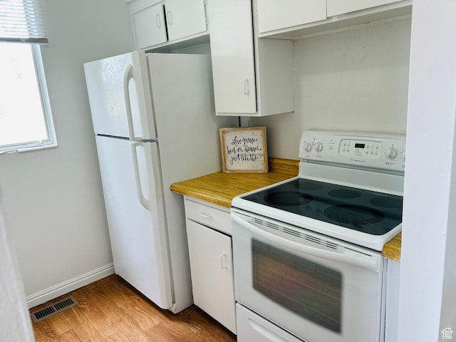 4419 S Rosehaven Ct Unit A, West Valley City, UT 84120 - kitchen featuring white appliances, white cabinets, light wood finished floors, and light countertops