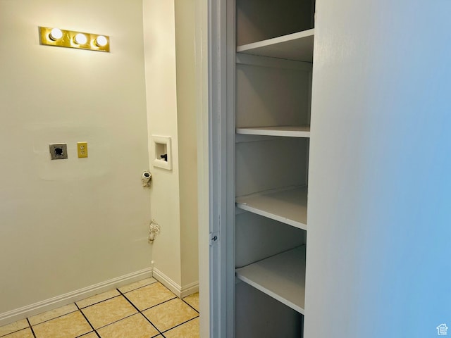 4419 S Rosehaven Ct Unit A, West Valley City, UT 84120 - washroom with hookup for an electric dryer, washer hookup, light tile patterned flooring, baseboards, and gas dryer hookup