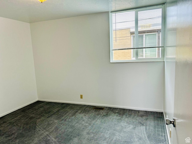 4419 S Rosehaven Ct Unit A, West Valley City, UT 84120 - spare room with dark carpet and baseboards