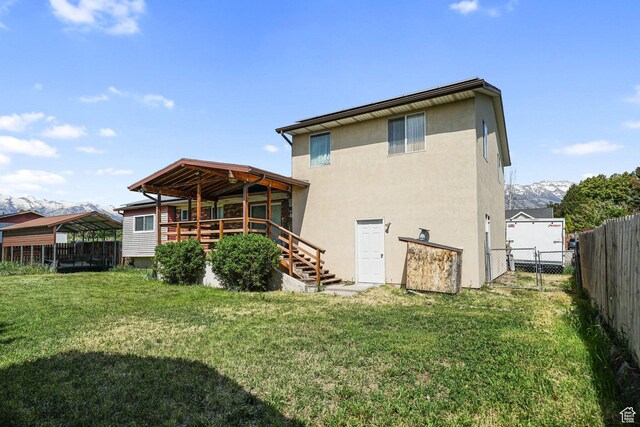 621 N 100 W, American Fork, UT 84003 - rear view of house with stairway, stucco siding, and a gate