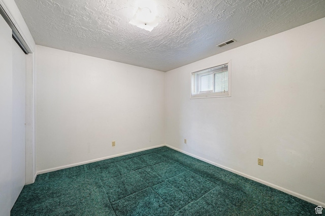 621 N 100 W, American Fork, UT 84003 - spare room featuring dark carpet, a textured ceiling, and baseboards