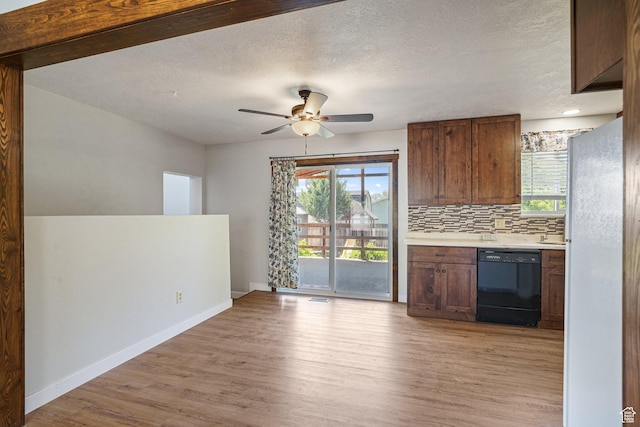 621 N 100 W, American Fork, UT 84003 - kitchen with dishwasher, light wood finished floors, healthy amount of natural light, freestanding refrigerator, and a textured ceiling