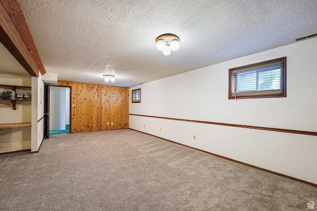 621 N 100 W, American Fork, UT 84003 - below grade area featuring a textured ceiling, carpet flooring, baseboards, and wooden walls