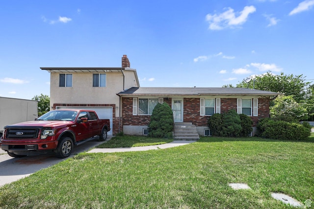 621 N 100 W, American Fork, UT 84003 - tri-level home featuring brick siding, a chimney, an attached garage, a front lawn, and concrete driveway