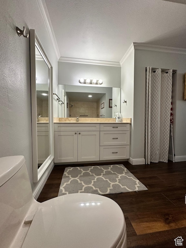 241 N Vine St E Unit 207W, Salt Lake City, UT 84103 - bathroom featuring ornamental molding, vanity, wood finished floors, and toilet