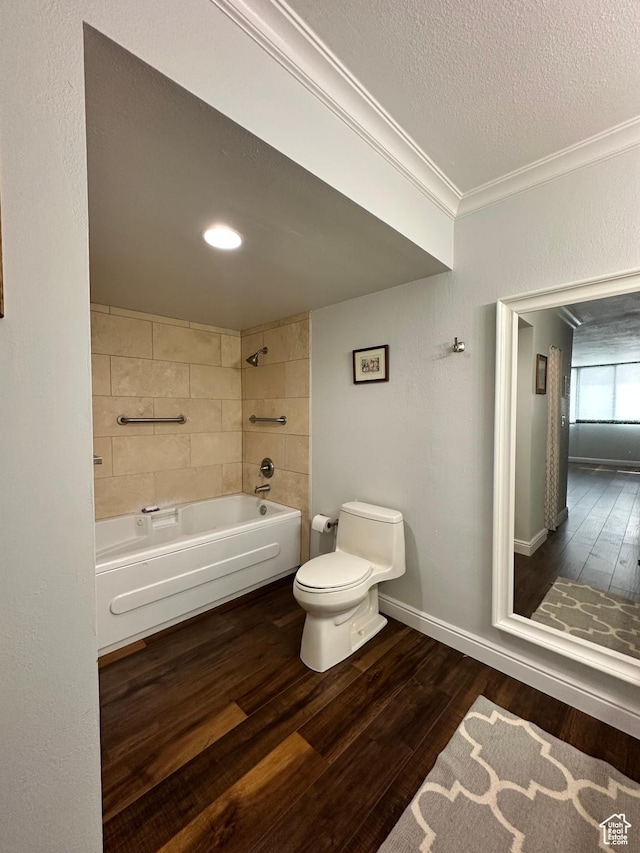 241 N Vine St E Unit 207W, Salt Lake City, UT 84103 - bathroom featuring toilet, wood finished floors, ornamental molding, bathtub / shower combination, and a textured ceiling