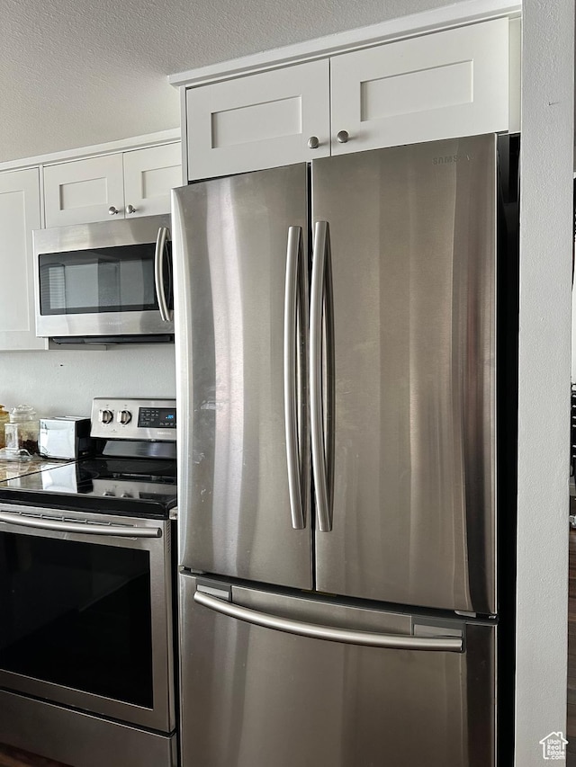 241 N Vine St E Unit 207W, Salt Lake City, UT 84103 - kitchen featuring stainless steel appliances and white cabinets
