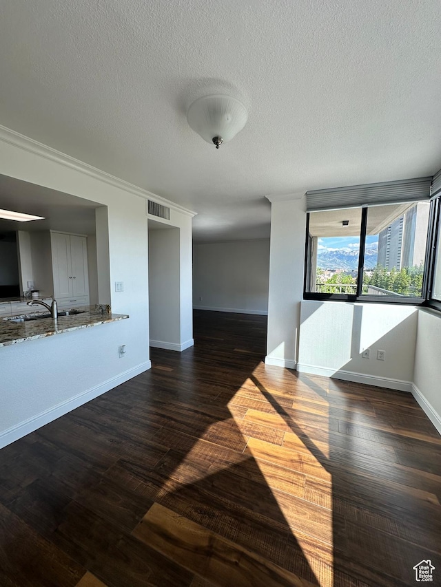 241 N Vine St E Unit 207W, Salt Lake City, UT 84103 - unfurnished dining area featuring a textured ceiling and wood finished floors