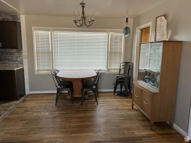 310 E Ashley Way S, Manila, UT 84046 - dining room featuring dark wood finished floors, a chandelier, and baseboards