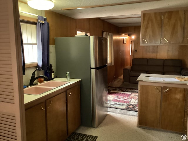 111 N 4th E, Manila, UT 84046 - kitchen featuring a sink, wooden walls, freestanding refrigerator, and light countertops