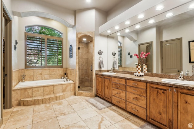 1744 E Burning Oak Dr, Draper, UT 84020 - bathroom featuring recessed lighting, double vanity, a bath, and a stall shower