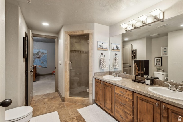 1744 E Burning Oak Dr, Draper, UT 84020 - bathroom featuring toilet, a shower stall, double vanity, and recessed lighting
