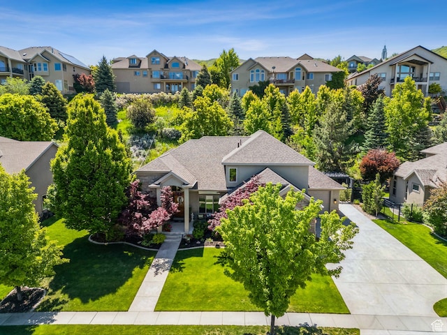 1744 E Burning Oak Dr, Draper, UT 84020 - view of front facade with a residential view, a front yard, a shingled roof, and driveway