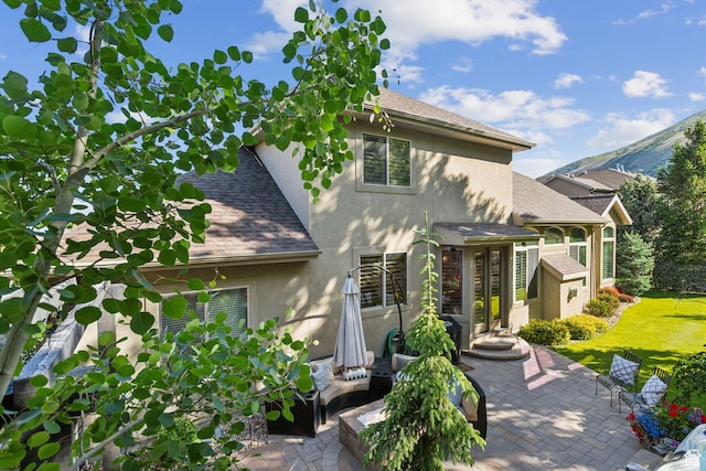 1744 E Burning Oak Dr, Draper, UT 84020 - view of front of property with stucco siding, a shingled roof, and a patio