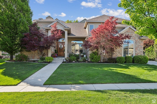 1744 E Burning Oak Dr, Draper, UT 84020 - obstructed view of property with stone siding, a front yard, and stucco siding
