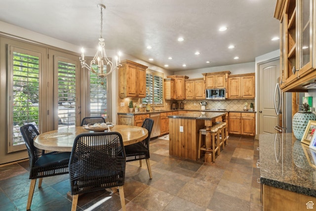 1744 E Burning Oak Dr, Draper, UT 84020 - dining room featuring a chandelier, recessed lighting, and dark stone finish flooring