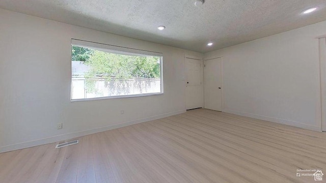 358 E 100 N, Provo, UT 84606 - spare room featuring a textured ceiling, light wood-style floors, recessed lighting, and baseboards