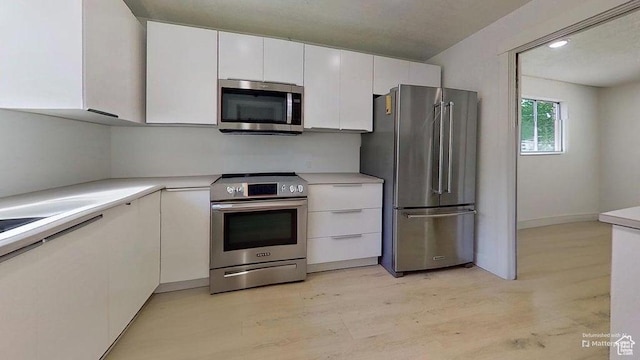358 E 100 N, Provo, UT 84606 - kitchen with appliances with stainless steel finishes, white cabinetry, light countertops, and light wood-type flooring