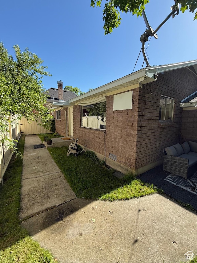358 E 100 N, Provo, UT 84606 - view of front facade featuring a chimney, brick siding, and a patio