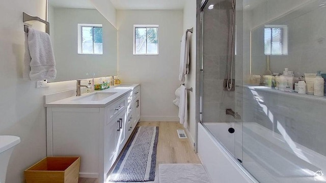 358 E 100 N, Provo, UT 84606 - full bath featuring toilet, vanity, shower / bath combination with glass door, wood finished floors, and baseboards