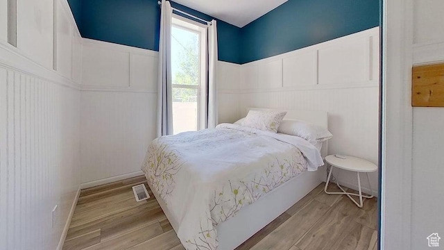358 E 100 N, Provo, UT 84606 - bedroom featuring a decorative wall, wood finished floors, and a wainscoted wall