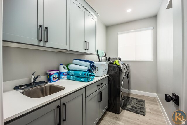 1060 W Jonathon Dr, Washington, UT 84780 - washroom with washing machine and dryer, cabinet space, light wood-style floors, baseboards, and recessed lighting