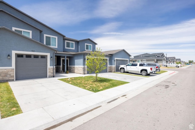 200 W 1200 S Unit 52, Tremonton, UT 84337 - view of front of property featuring stone siding, driveway, stucco siding, and a residential view